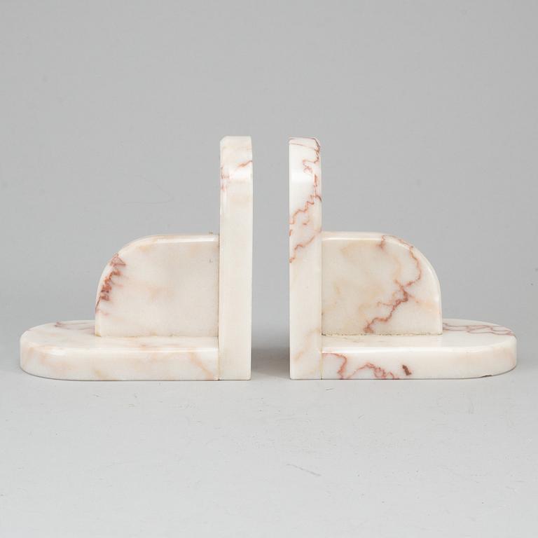 A pair of marble book ends, 20th century.