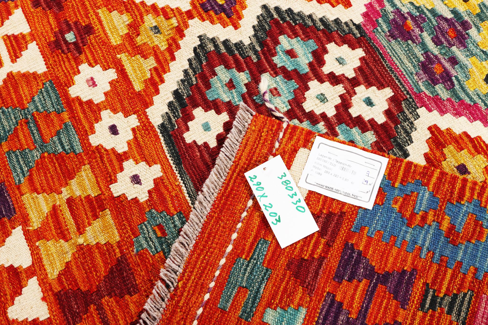 An Afghan kilim rug, c. 290 x 203 cm.