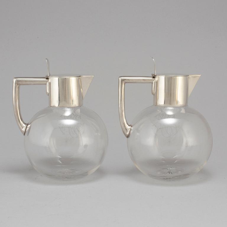 A pair of caraffes with silver mountings by CG Hallberg, Stockholm 1890.