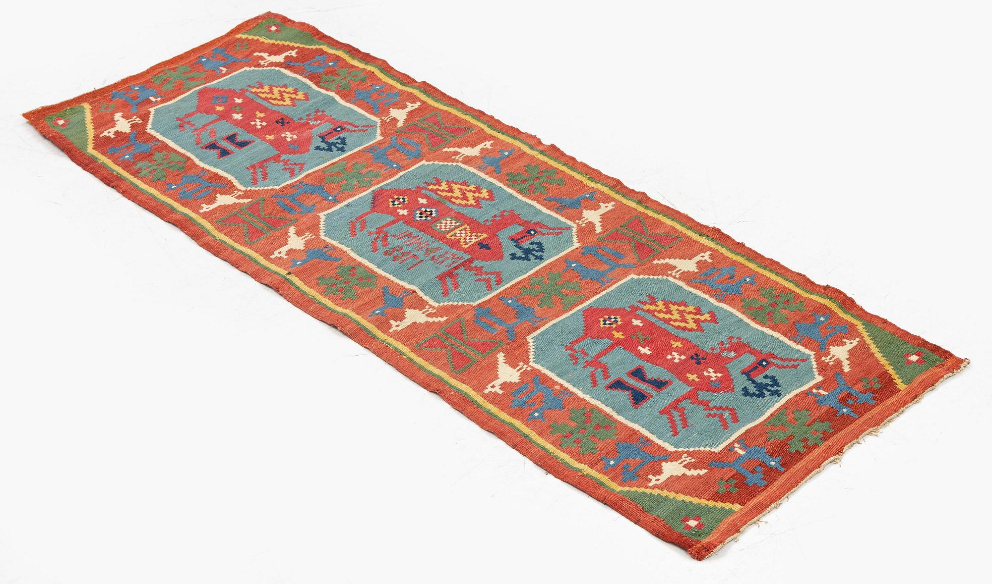 A double-interlocked tapestry carrige cushion, ca 108 x 51 cm, 'Bäckahästen', dated 1788.