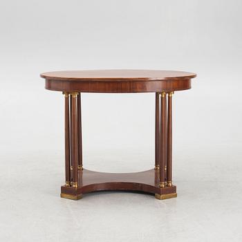 An Empire style table, early 20th Century.