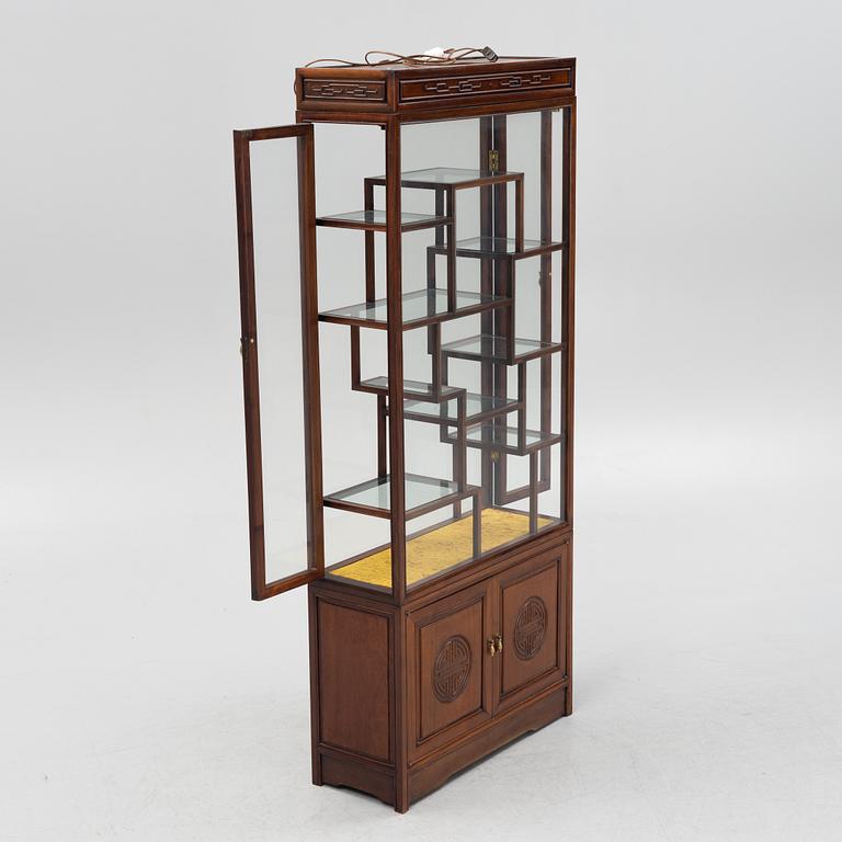 A Chinese hardwood cabinet, mid 20th century.