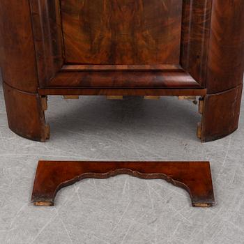 A pair of mahogany corner cabinets, mid 19th Century.