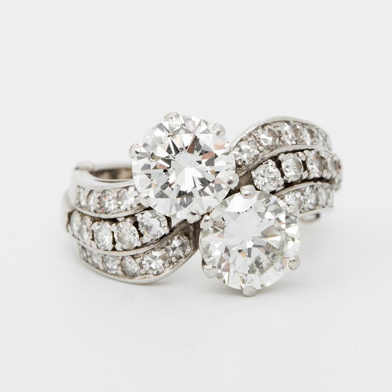 A WA Bolin platinum ring set with two round brilliant-cut diamonds with a total weight of ca 3.50 cts.