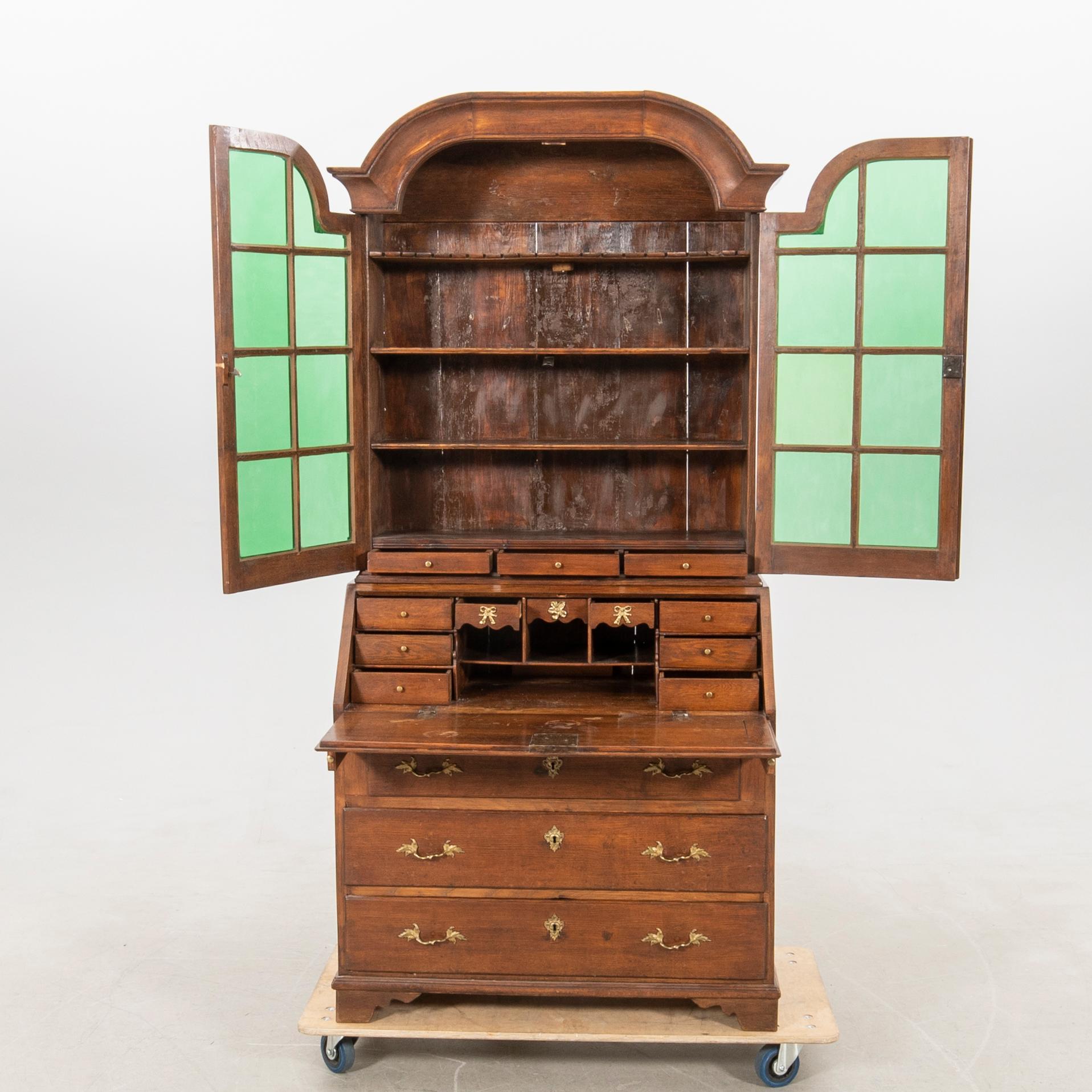 Slant-front secretary with a glazed section, 18th century.