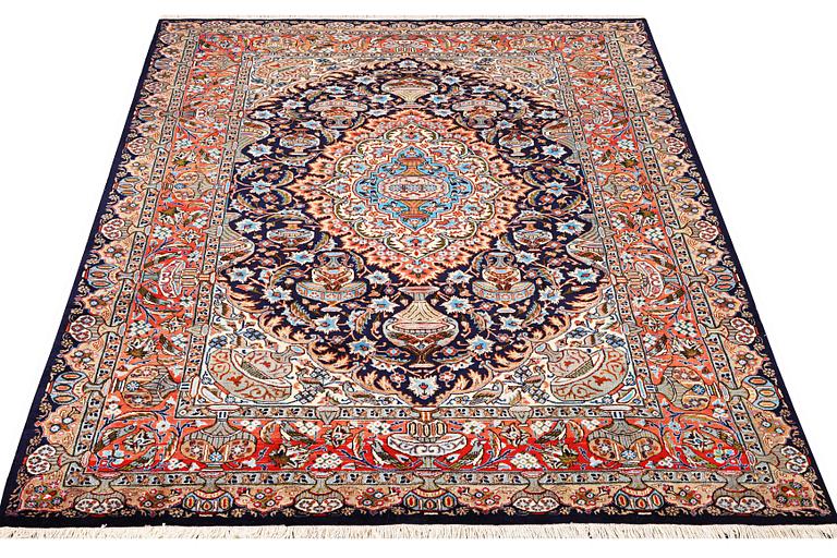 A Kashmar carpet, c. 310 x 203 cm.