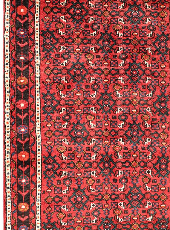 A Hosseinabad runner, c 414 x 95 cm.