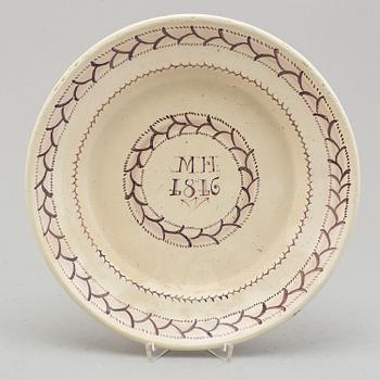 An faience dish dated 1816.