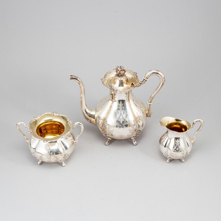 A silver coffee pot, creamer and sugar bowl. GAB, Stockholm 1945.