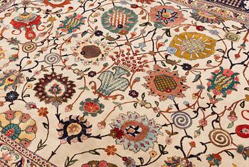 A semi-antique Tabriz carpet, Northwest Persia, of Safavid 'Vase' design, c.328 x 242 cm.