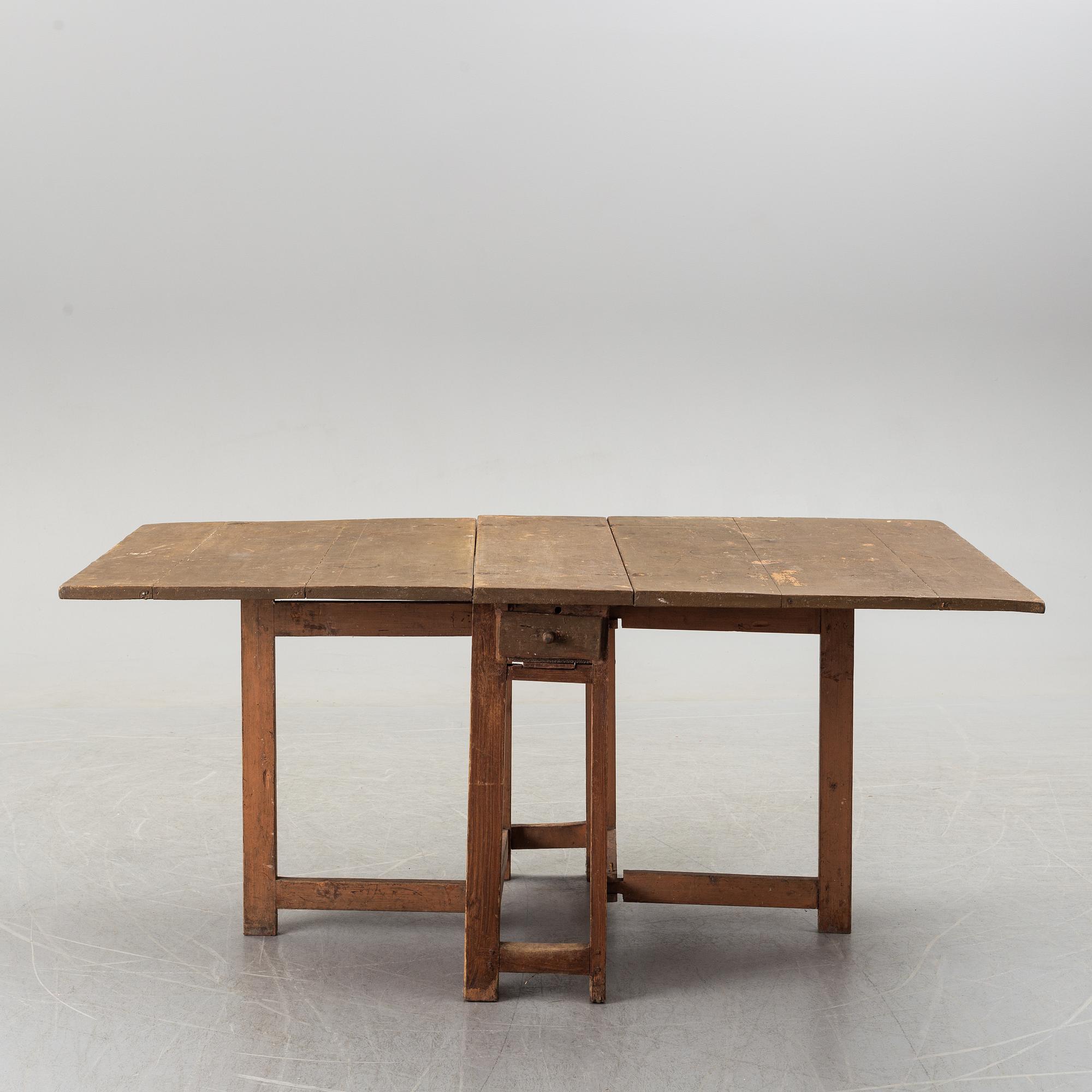 A 19th century painted gate leg table.