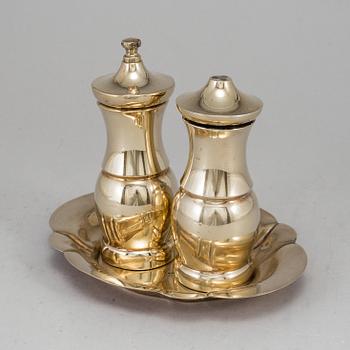 A pair of Tiffany & Co. silver-gilt sterling silver salt- and pepper grinder set.