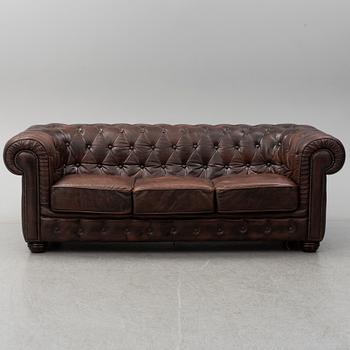 A 20th century leather upholstered Chesterfield sofa by Rubelli.