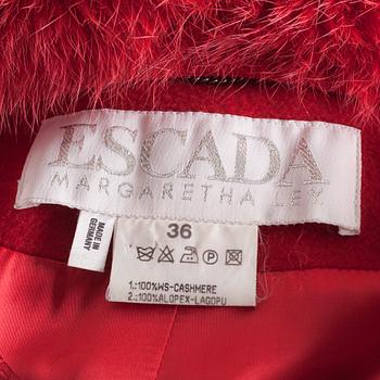 A red cashmere coat with detachable fur neck by Esacada.