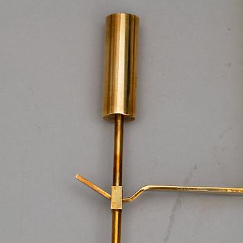 VÄGGLJUSSTAKAR, ett par, Mässing. "Pendel", Pierre Forsell, Skultuna, Sverige, 1900-talets andra hälft.