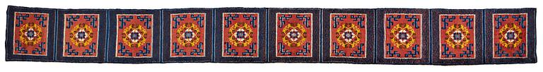 A MEDITATION CARPET, ten squares, a semi-antique Ningxia, China, ca 598,5 x 62 cm.