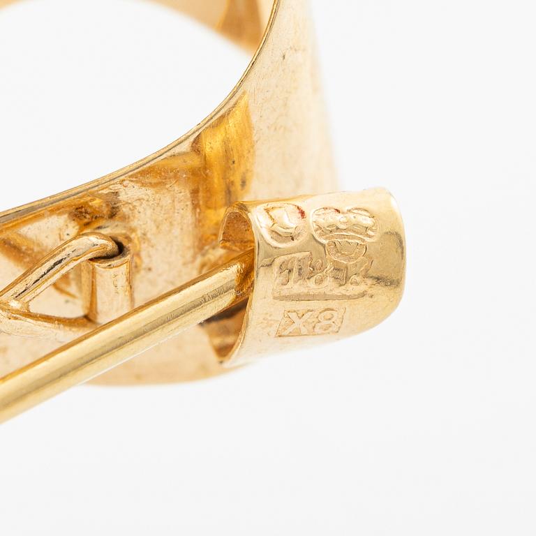 Brooch, 18K gold in the form of a bowknot.