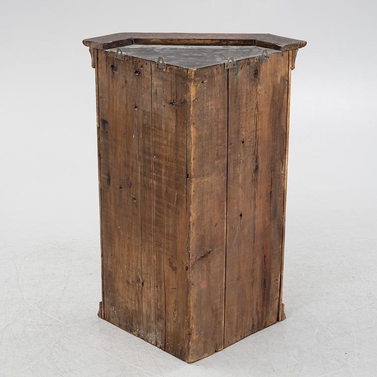 A 18th century corner cabinet.