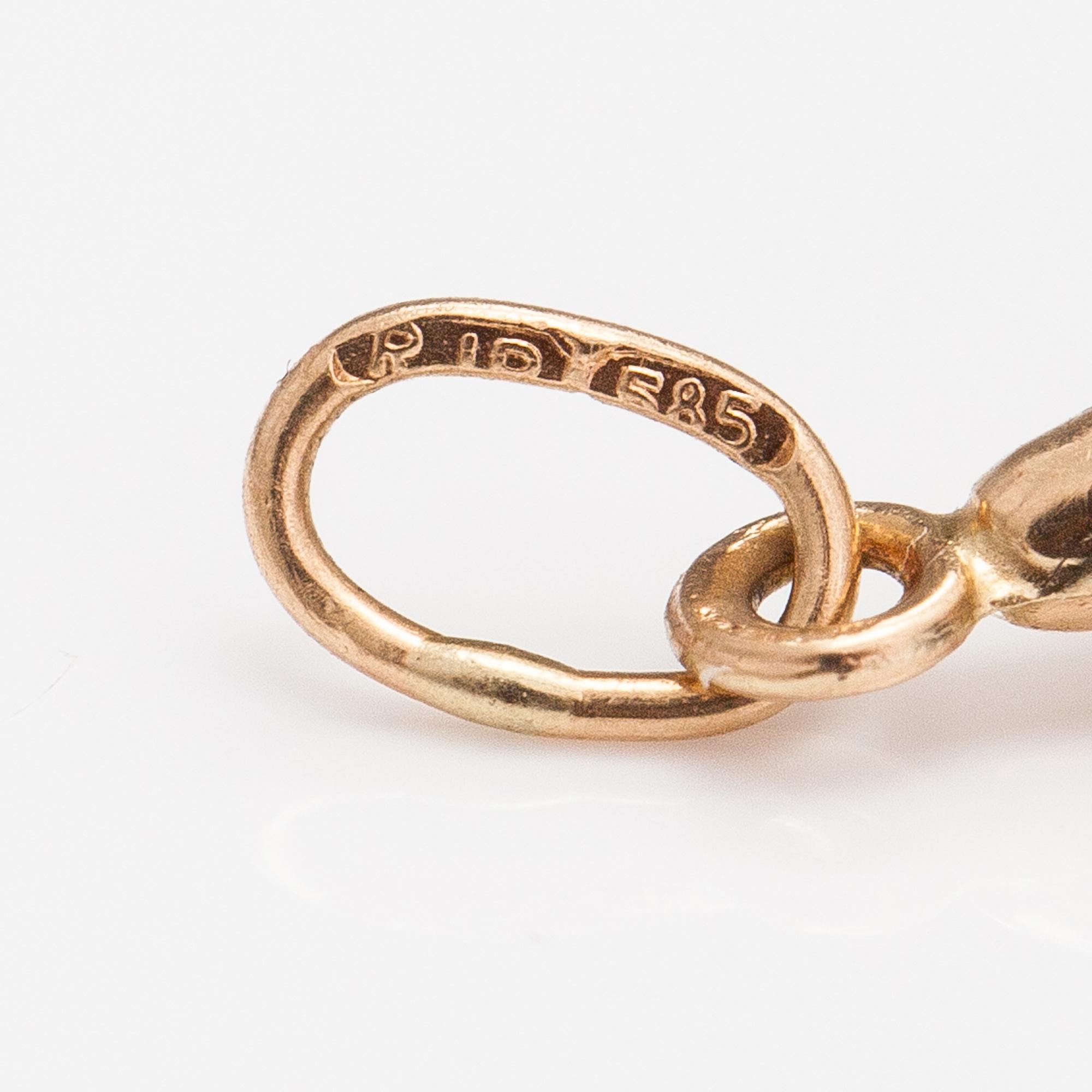 Two 14K gold pendants one with a diamond ca. 0.0025 ct.