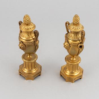 A pair of bronze empire style casolettes from around the year 1900.