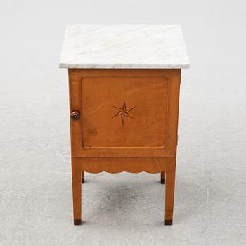 An early 20th Century bedside cabinet.