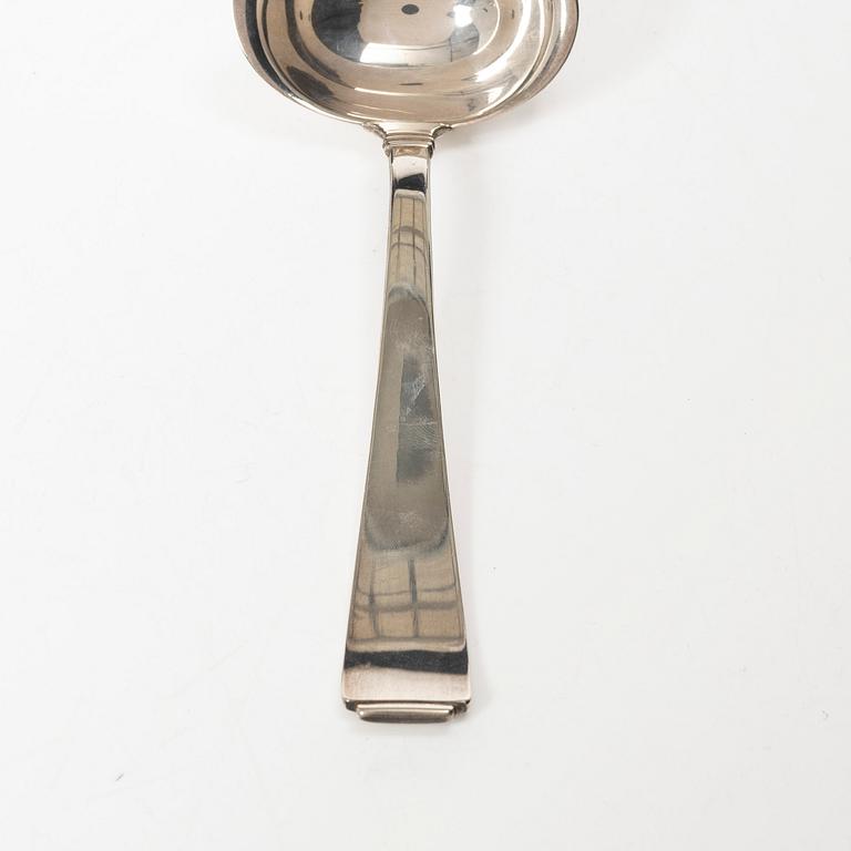 Gustaf Möllenborg, a silver bowl, Stockholm 1851, six silver punch cups, including CG Hallberg, and a silver spoon.