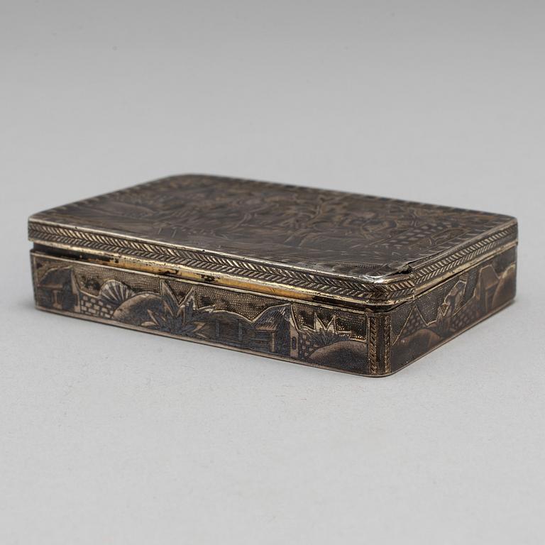 A Russian mid 19th century silver-gilt and niello snuff-box, mark of Moscow.
