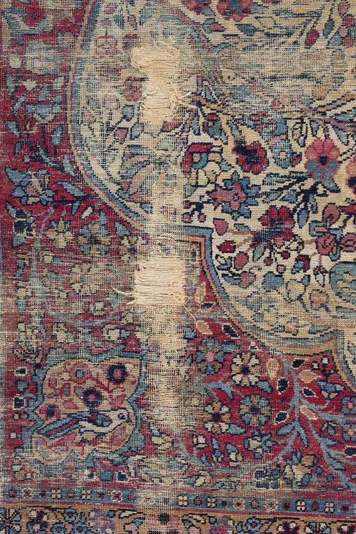 A semi-antique Kerman carpet, c. 325 x 203 cm.