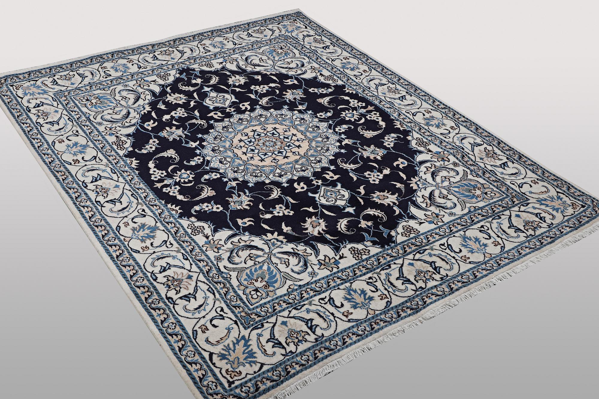 A carpet, Nain, part silk, ca 256 x 199 cm.