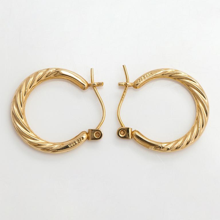 A pair of 14K gold earrings.