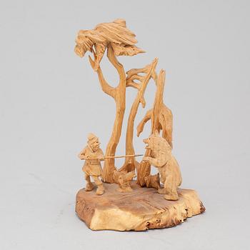 Jutsajaure, sculpture group, carved wood, signed M.S.