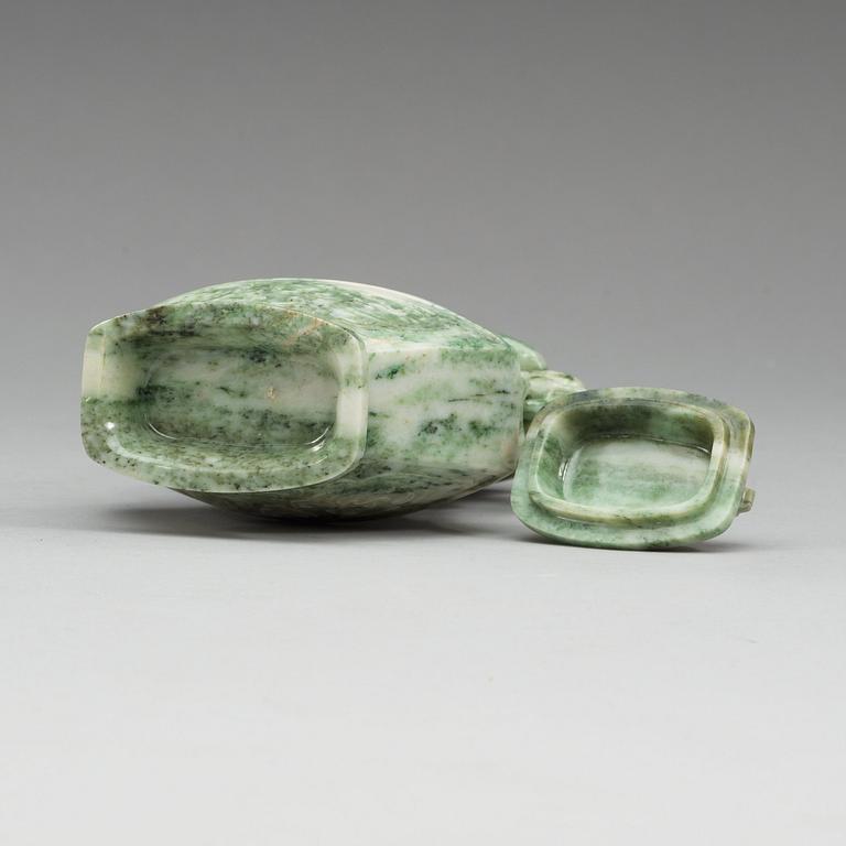A Chinese archaistic green stone vase with cover, 20th Century.