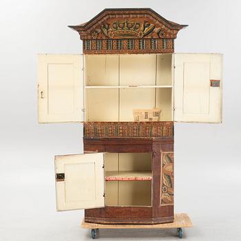 A Swedish traditional painted cabinet, dated 1819.