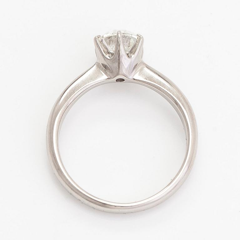 A platinum ring, with a brilliant-cut diamond approximately 1.00 ct according to the engraving.