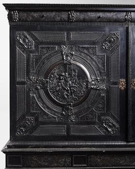 A Louis XIV and Louis XIV-style carved ebony, ivory and tortoiseshell-inlaid cabinet on stand, 17th and 19th century.