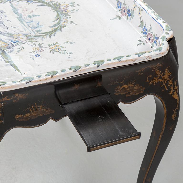 A Swedish Rococo faience tea table, Marieberg 1770.