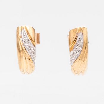 A pair of 14K ogld earrings with diaomnds ca. 0.036 ct in total. Finland 1992.