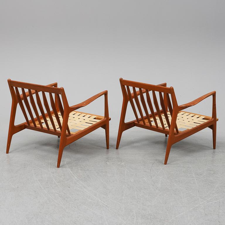 A pair of late 20th Century easy chairs.
