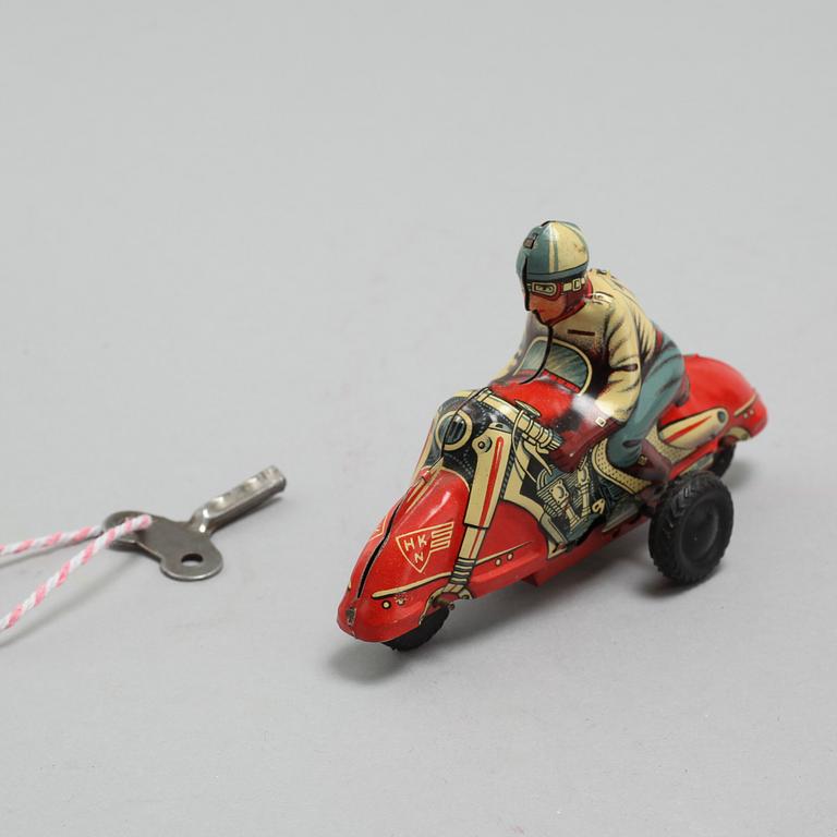 A collection of 6 tin toys, Schuco Akustico 2002, among others, circa mid 20th century.