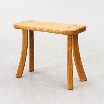 A solid pine stool, signed RO -99, Sweden.
