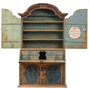 A polychrome-painted folk art cabinet from Värmland, Sweden, dated 1818.