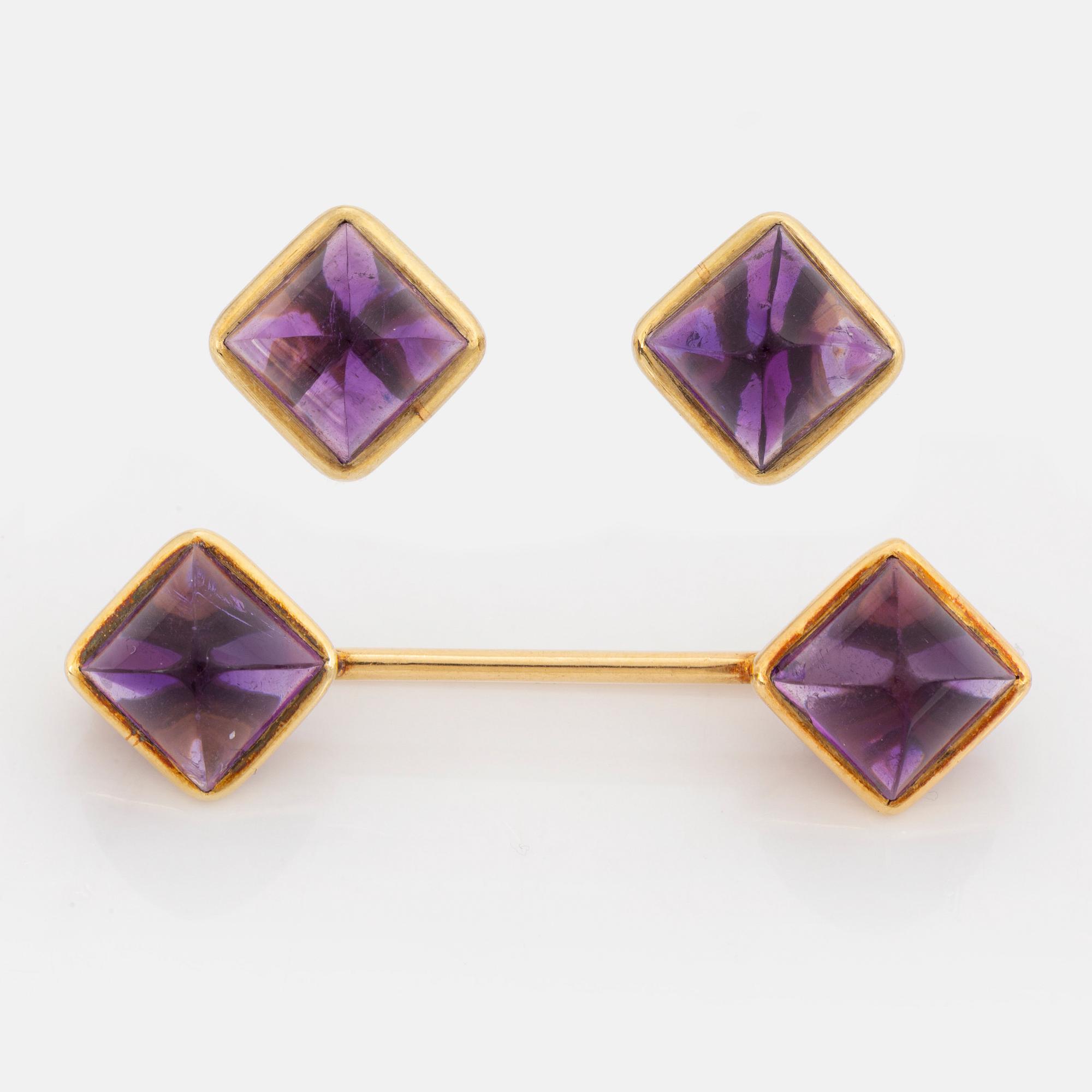 Brooch and earrings with cabochon cut amethysts.