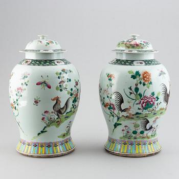 A pair of large Chinese famille rose baluster jars with covers, 20th century.