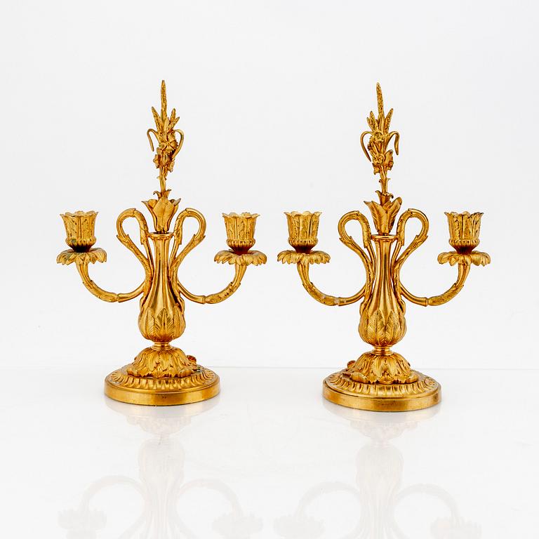 A pair of Louis XV-style bronze candelabras.