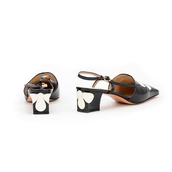 LERRE, a pair of black patent leather sandals.