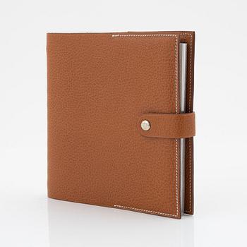 Hermès, a whisky leather notebook/agenda.