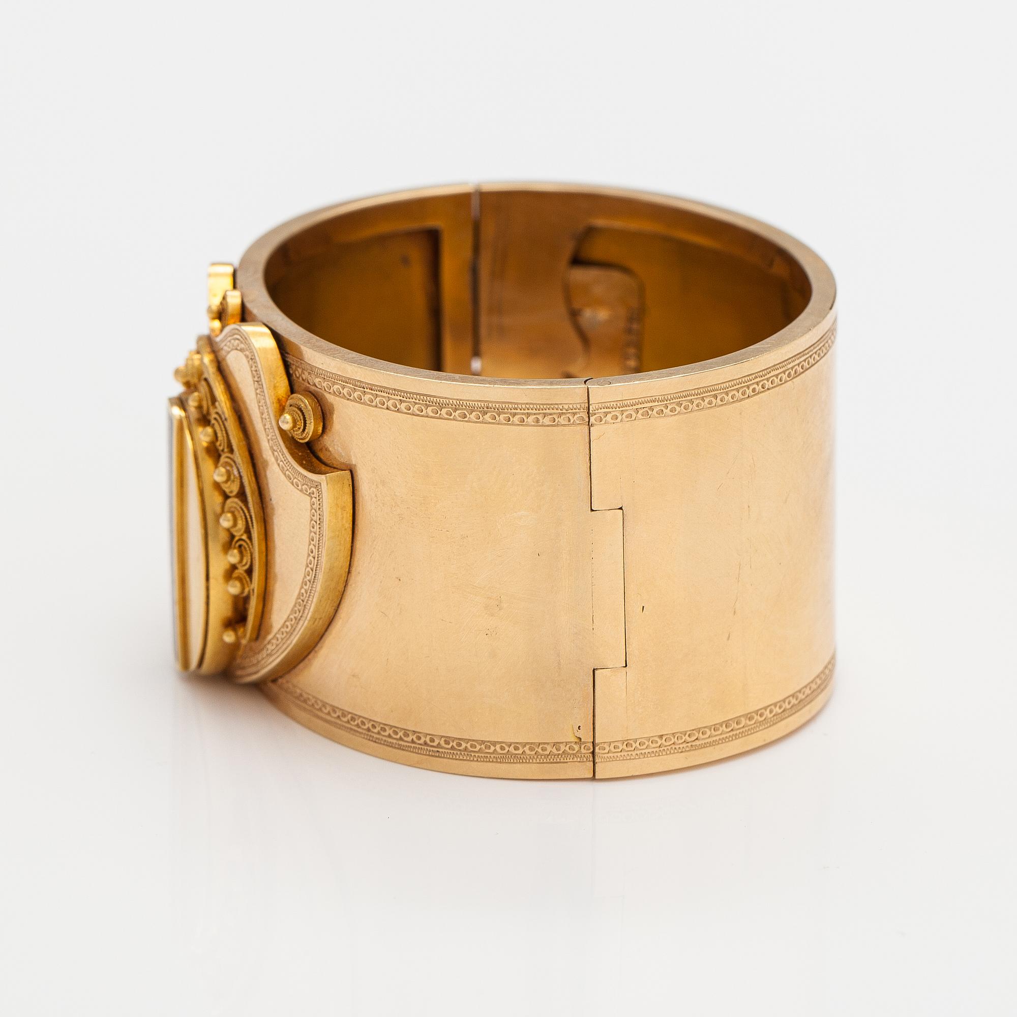 Armband, 18K guld, emalj. Olof Robert Lundgren, Åbo 1859 eller 1874.
