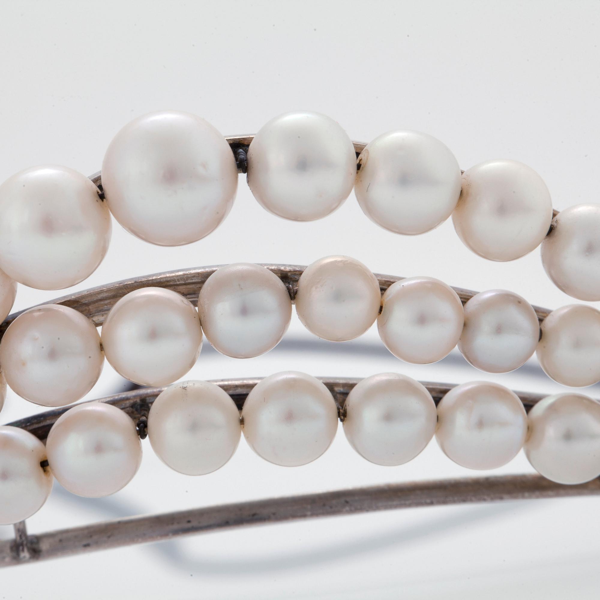 A TIARA with cultured pearls and a detachable brooch set with old-cut diamonds.