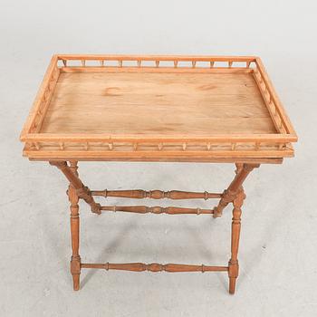 An oak tray table around 1900.