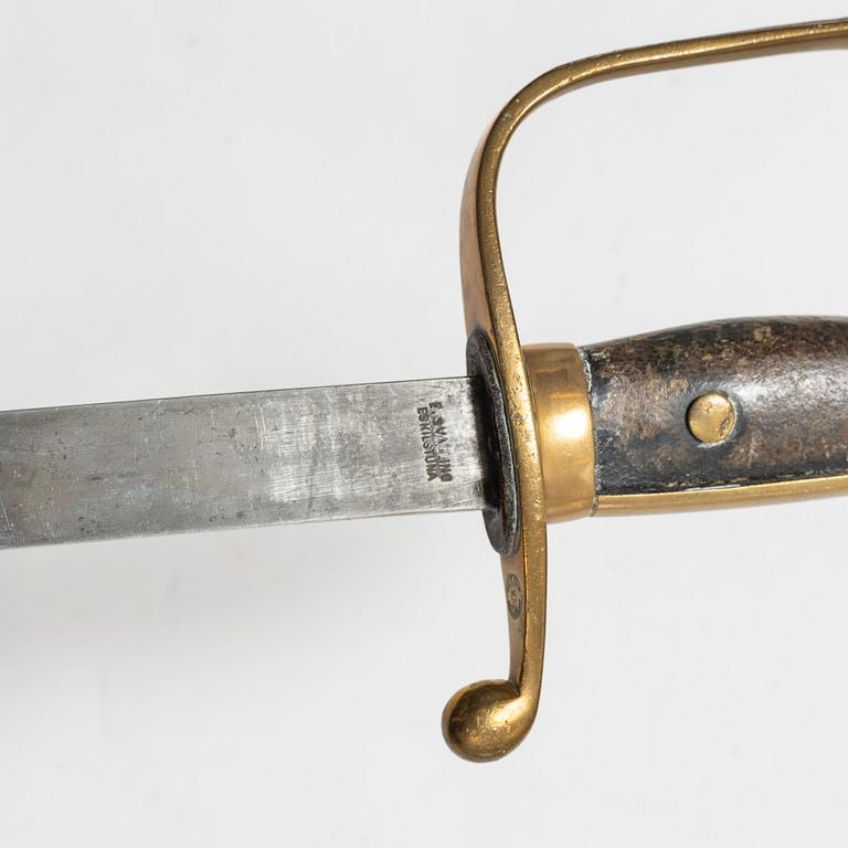 A Swedish police sabre and cutlass, with scabbards.